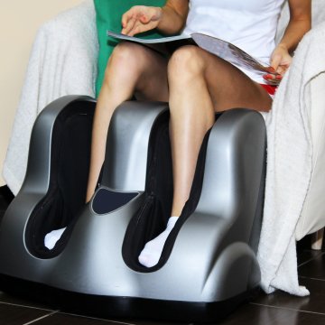 woman getting a foot massage foot massager